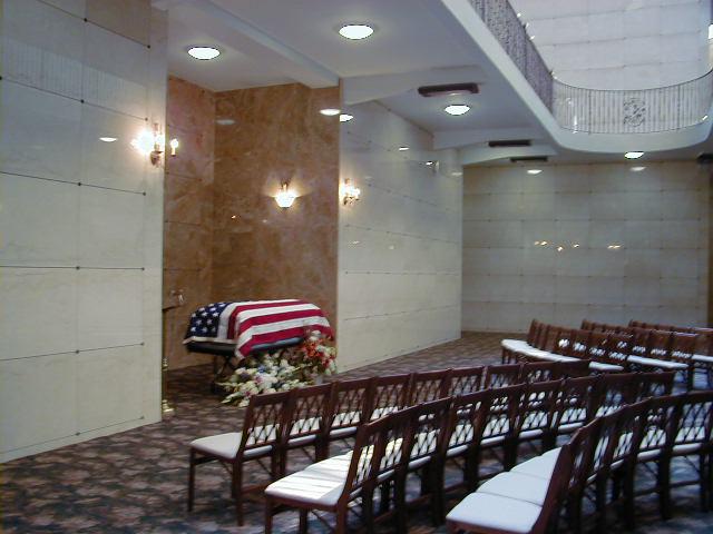 american flag drapped over the casket in a mausoleum american flag drapped over the casket in a mausoleum