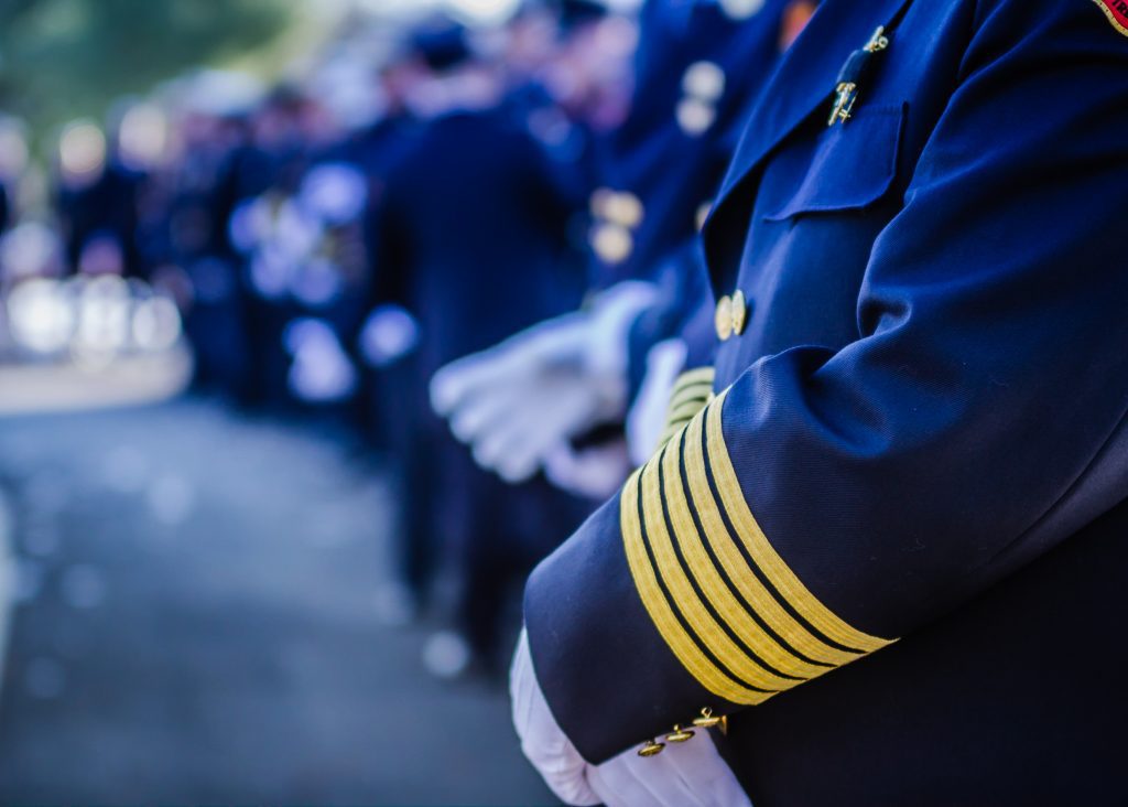 Men in uniforms at funeral service Men in uniforms at funeral service