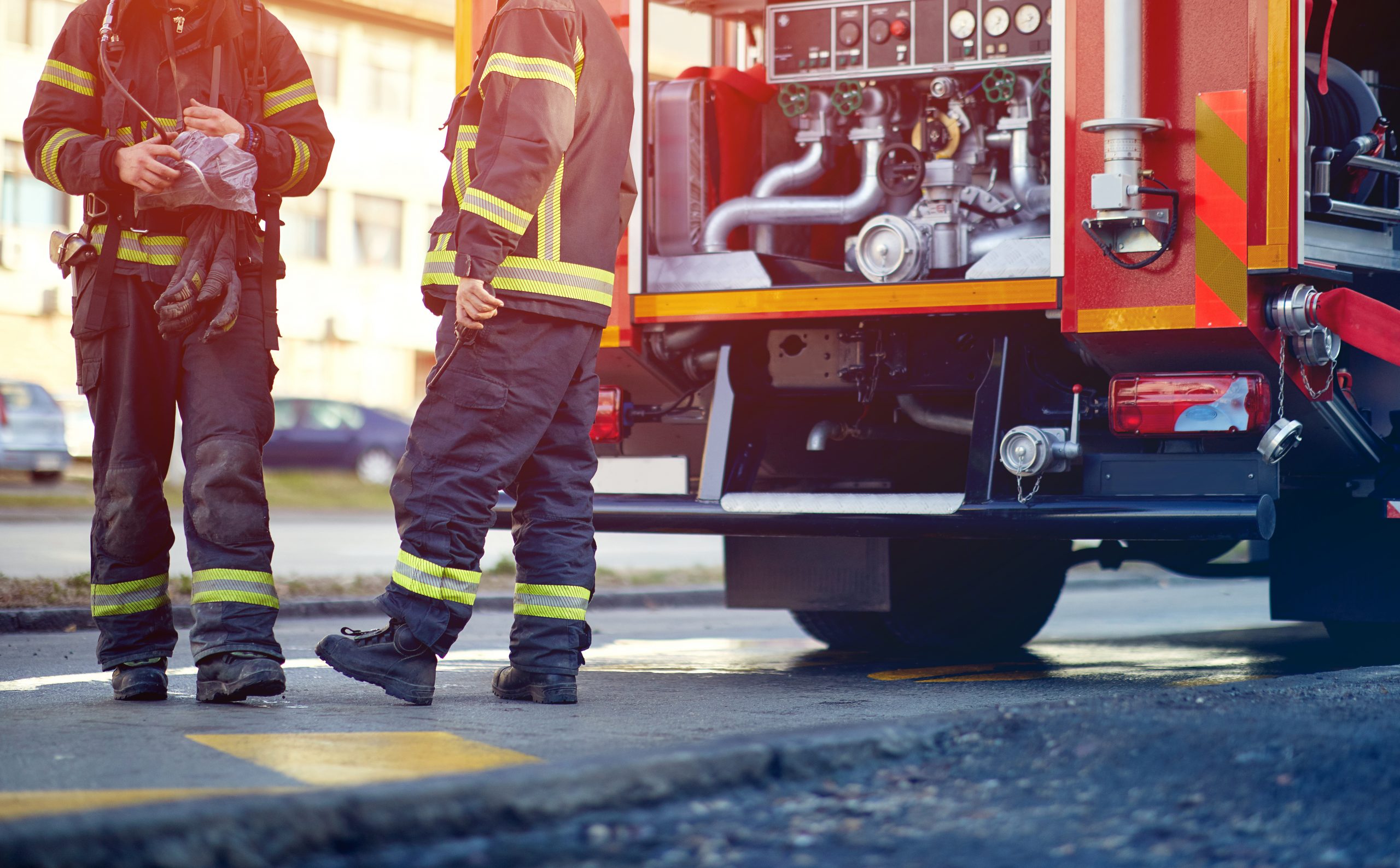 Firefighters outside of fire truck